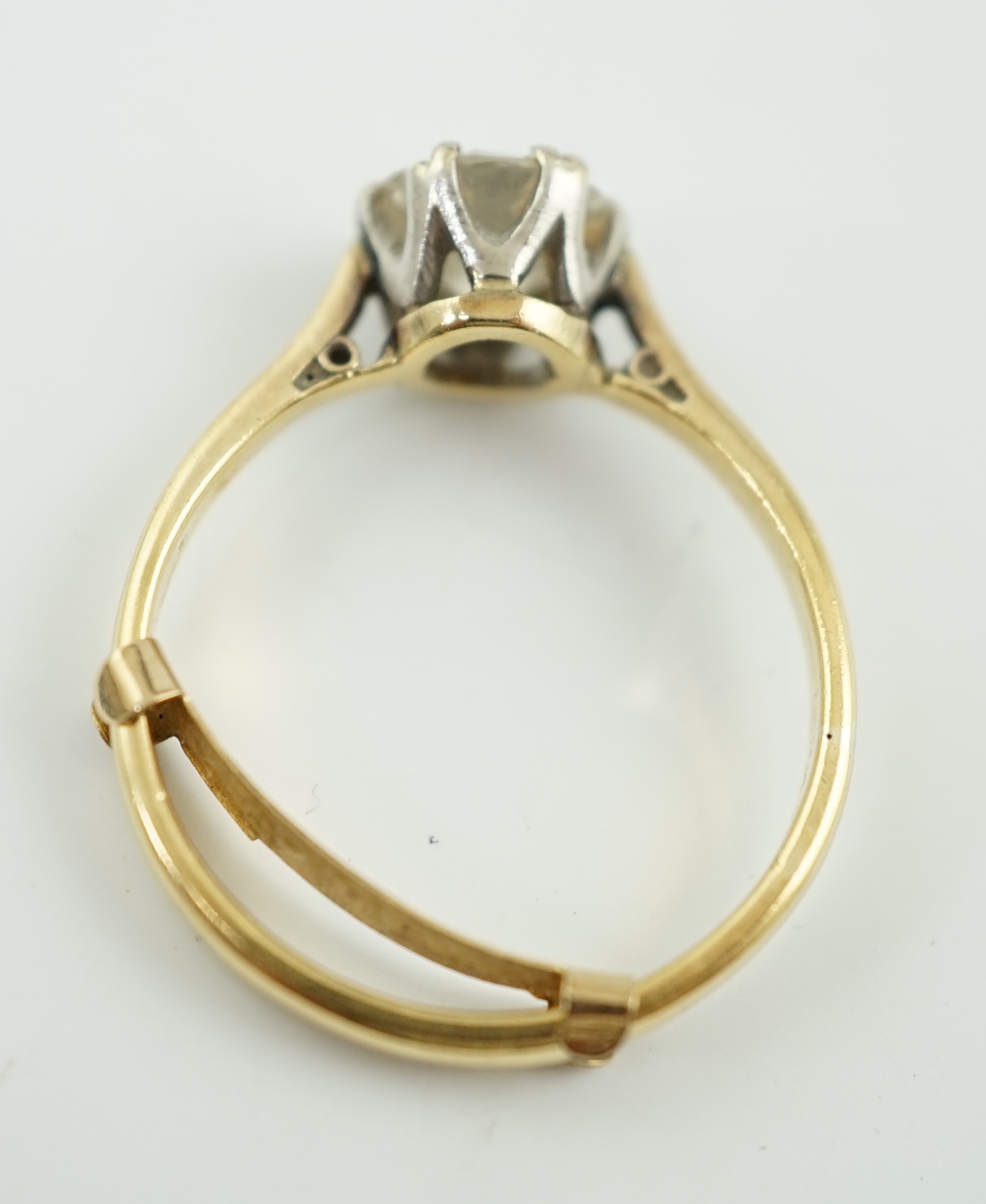 A gold and solitaire diamond set ring